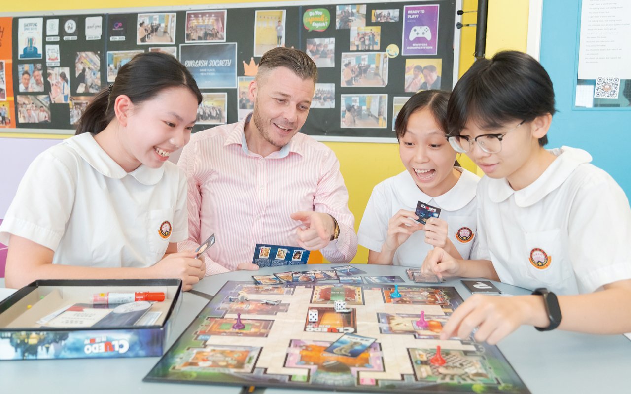 Through interactions with foreigners, students learn and use English in daily communication